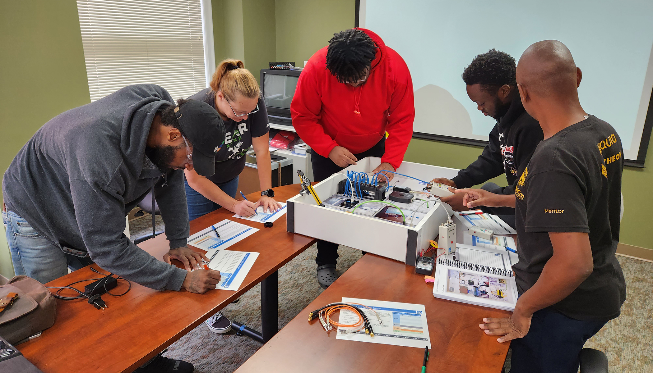 Instructor points to circuit board