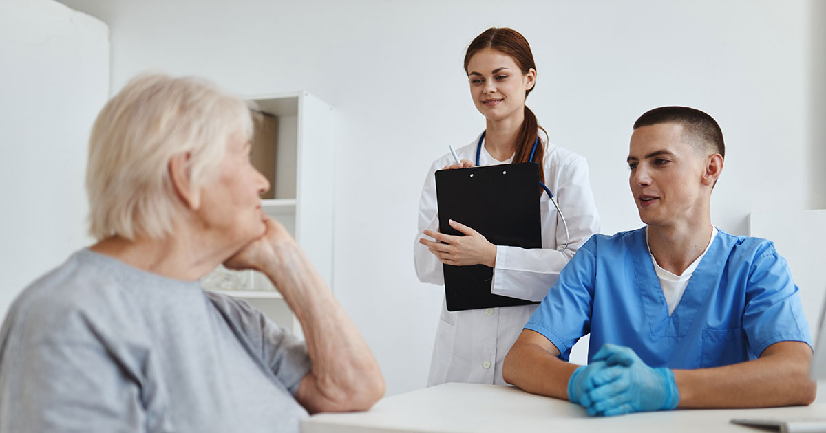 two nurses with patient