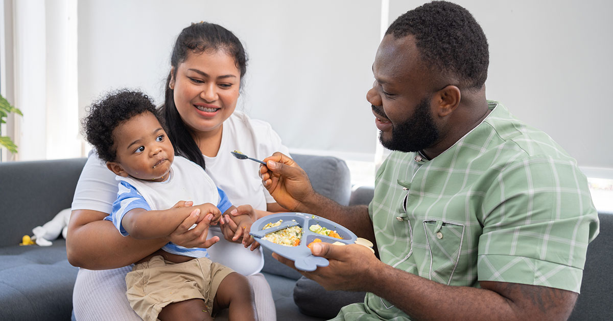 Family feeding baby